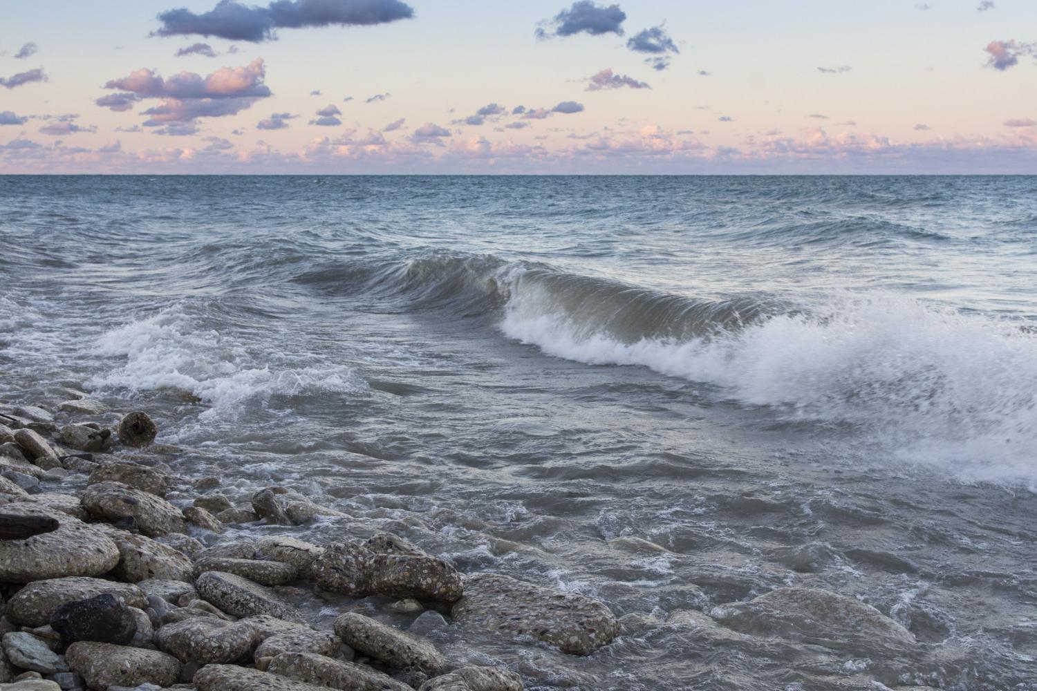 The sun rises over Lake Michigan on the <a href='http://rf8k.dgbts66.com'>BETVLCTOR伟德登录</a> campus.